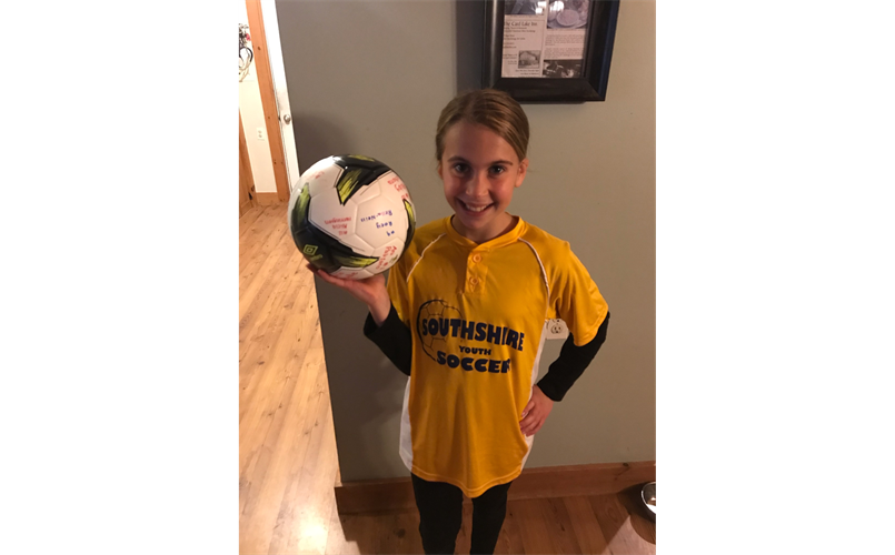 Hayleigh Coyne, winner of signed soccer ball 